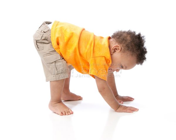 Real People: Black Toddler Boy Orange Bending Over Tumbling